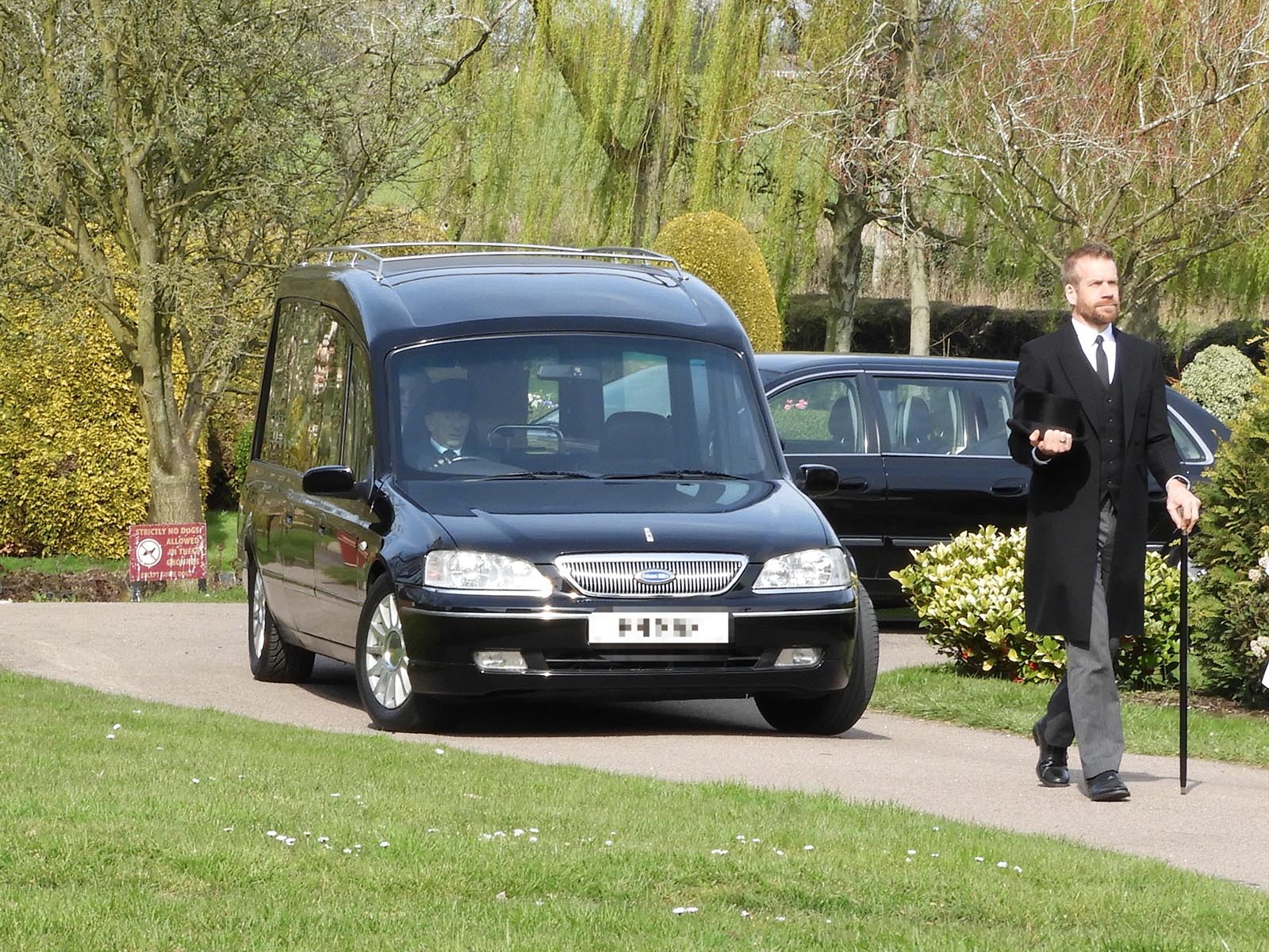 Adam March directing a funeral in 2019